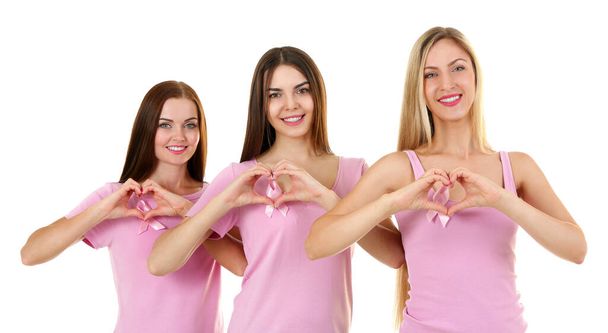 白い背景にピンクのシャツを着た美しい若い女性。乳がんの概念 - 写真・画像