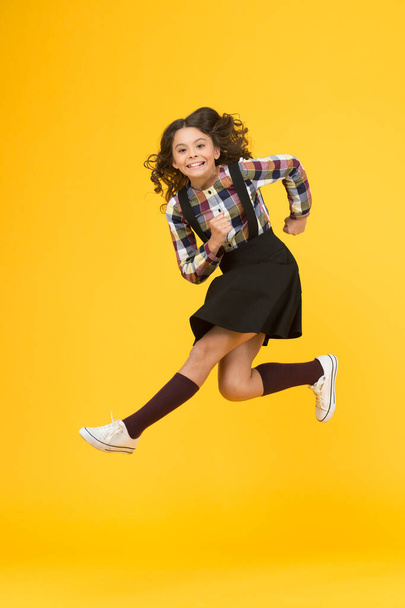 Run for fun. Happy kid have fun yellow background. Little child in midair. School holidays. Play and fun. Free times. Active games. Childhood activity. Non stop fun - Φωτογραφία, εικόνα