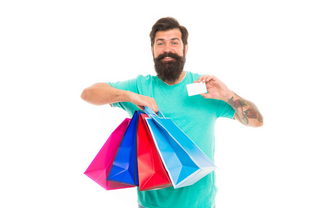 Satisfied customer. Easier than ever. Contactless payment. Credit card. Bearded man with bags and discount card. Purchase concept. Happy man shopping. Payment method. Bank card. Black friday sale - Foto, Imagem