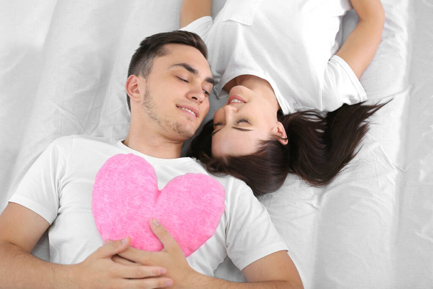 Happy couple on bed - Photo, Image