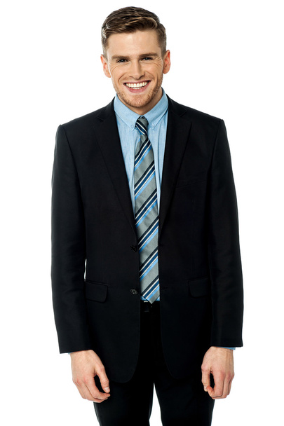 Smiling businessman posing casually - Foto, afbeelding