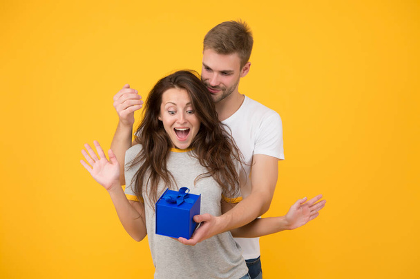 Make her wow. Surprised woman got present from man. Birthday surprise. Couple in love. Surprise box. Surprise gift. Present and souvenir. Gift shop. Gifting surprise. Happy Valentines day - Φωτογραφία, εικόνα