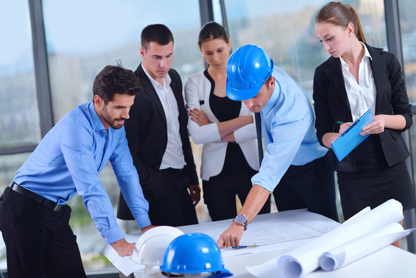 Business people and construction engineers on meeting - Фото, изображение