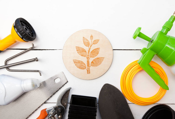 A lot of different garden equipment on the wooden table - 写真・画像