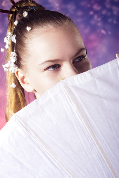 young teenage girl in floral kimono in studio - Photo, Image