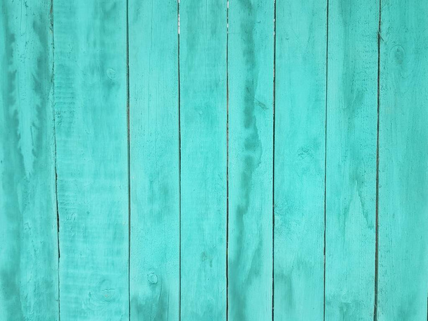 Achtergrond van houten platen geschilderd met turquoise verf - Foto, afbeelding