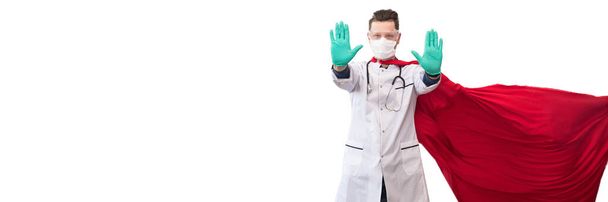 Een dokter in een kostuum van een superheld verdedigt zich tegen een virale pandemie. - Foto, afbeelding