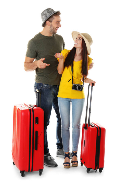 Couple heureux avec valises sur fond blanc
 - Photo, image