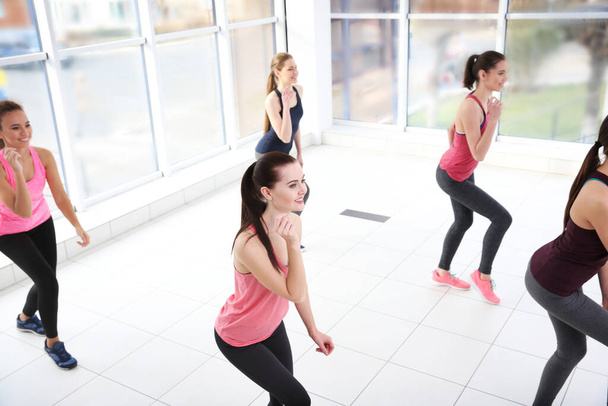 Young sporty women training in dance hall - Photo, Image