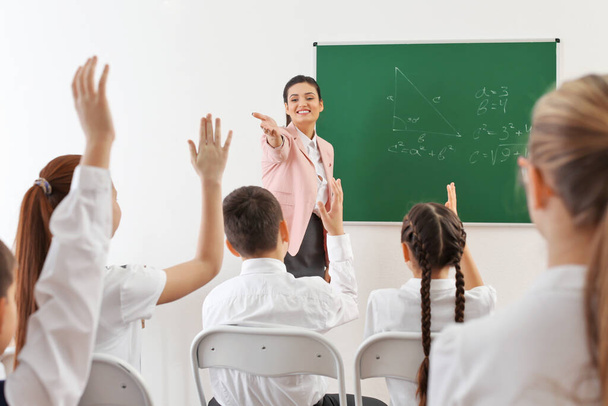 Female teacher conducting lesson in classroom - Foto, immagini