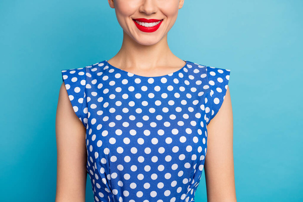 Cropped closeup photo of pretty lady show perfect teeth red lips allure tempting shape veneers whitening wear dotted white retro blouse shirt isolated blue color background - Foto, Imagem