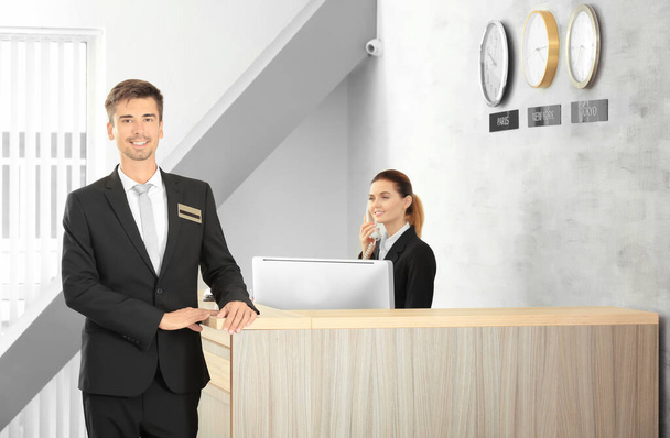 Male receptionist working in hotel - Photo, image