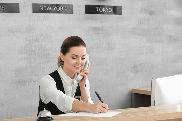 Female receptionist working in hotel - Photo, Image