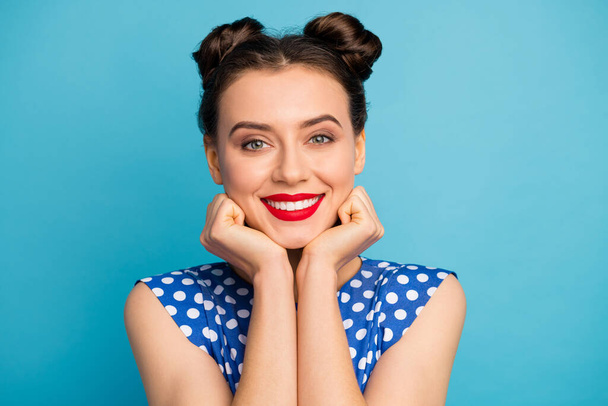 Closeup photo of pretty charming lady red pomade hands hold face head overjoyed affectionate overjoyed cute wear dotted white retro blouse shirt isolated blue color background - Foto, Imagem