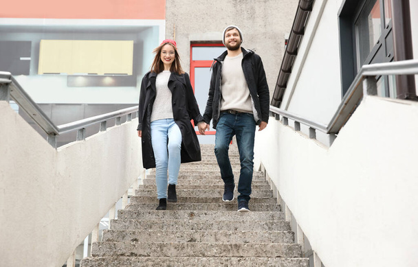 Trendy hipster couple on stairs outdoors - Photo, image