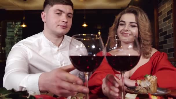 Portrait of woman and man drinking red wine in restaurant - Felvétel, videó