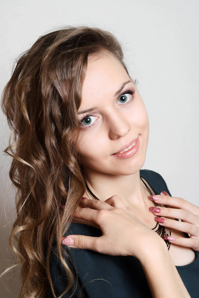 beautiful sweet woman with shiny curly hair studio - Zdjęcie, obraz