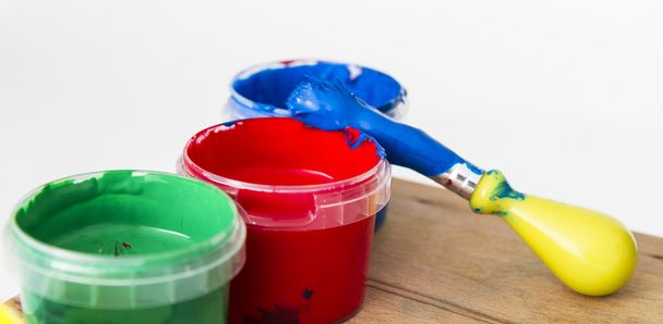 green, red andblue paint with brush - 写真・画像