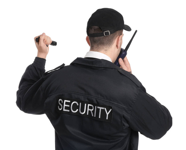 Male security guard with flashlight on white background - Photo, Image