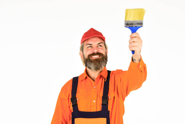 Construction and renovation. Decoration and decor. Walls of home desperate need of new color palette. Bearded mature man painter. Wall painter with painting tool. Hipster painter. Painters work - Foto, afbeelding