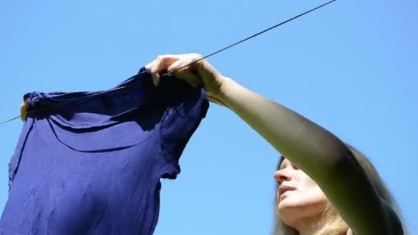 Woman hang laundry - Footage, Video