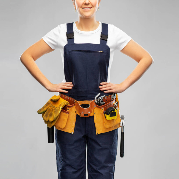 female worker or builder with working tools - Zdjęcie, obraz