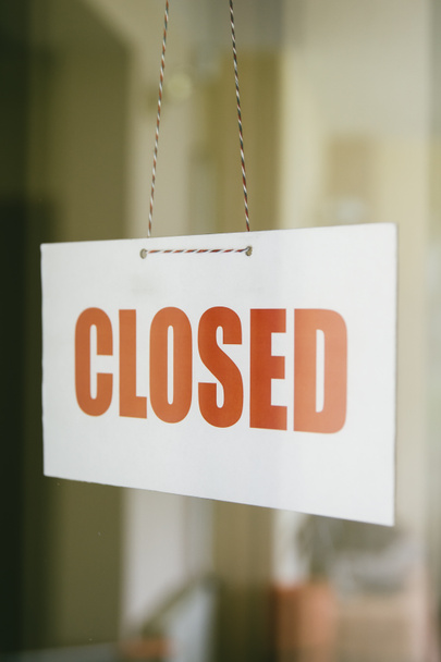 Closed sign board hanging on the glass door of cafe or small store - Photo, Image