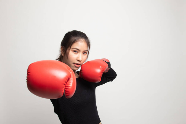 Young Asian woman with red boxing gloves on white background - Photo, Image