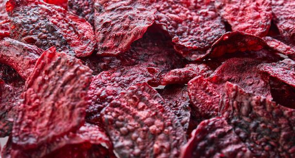 Diet healthy eating concept. Healthy purple baked beets or dried beets with sea salt. Background texture. Organic natural food. - Фото, изображение
