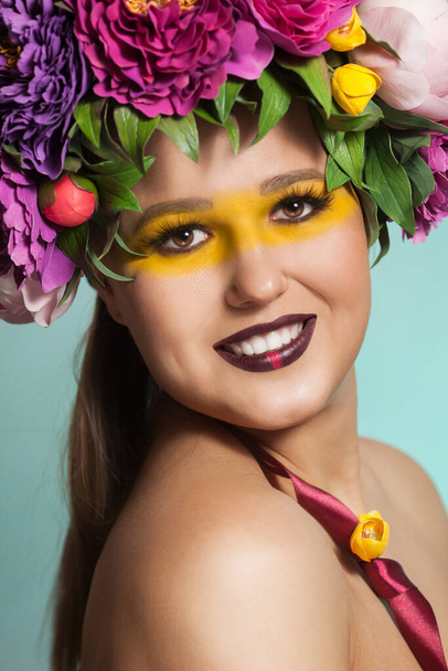 Beautiful brunette woman with flower wreath on her head. - Фото, зображення