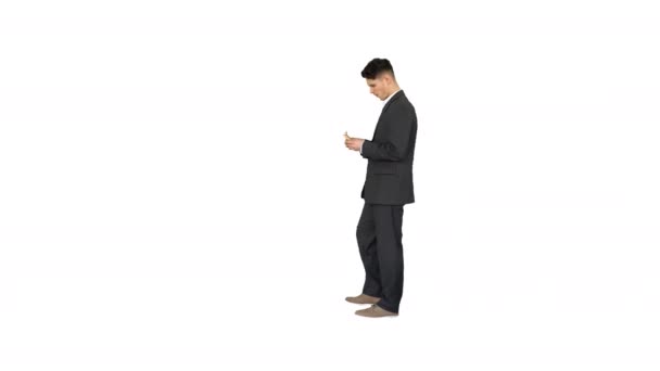 Young happy businessman dancing after counting salary Win dance on white background. - Footage, Video