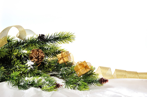 Branch of Christmas tree on a white background with toys and gif - 写真・画像