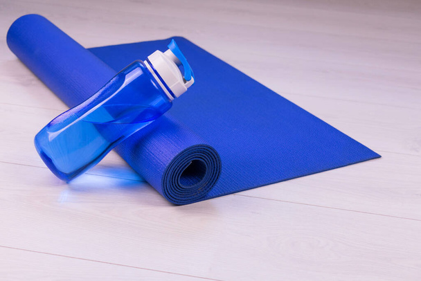 Blue sports mat and sports water bottle.Healthy lifestyle concept. - Photo, Image