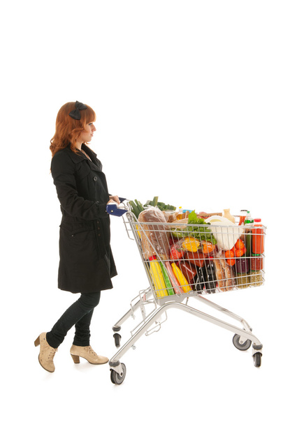 Woman with Shopping cart full dairy grocery - Foto, imagen