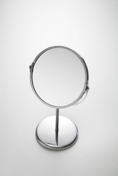 Face mirror against white background - 写真・画像