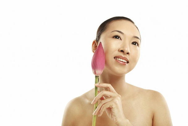 Woman posing with a flower - 写真・画像