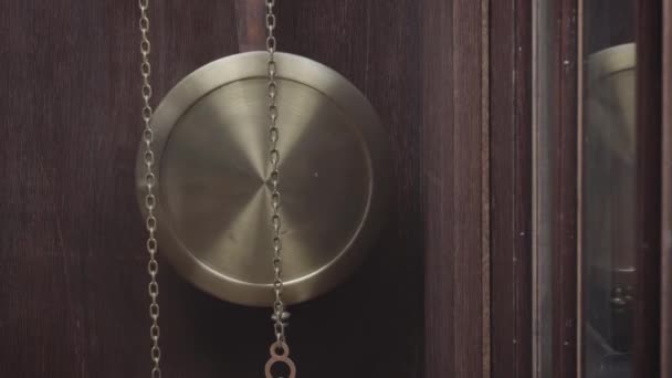 Macro shot of an antique vintage clock with a pendulum in motion - Footage, Video