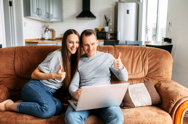 Couple using a laptop for talking online - Fotó, kép