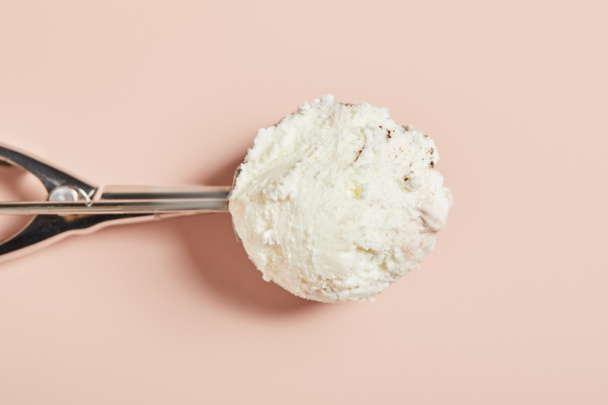 top view of fresh tasty ice cream ball in scoop on pink background - Photo, image