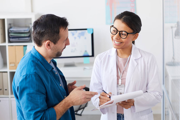 Patient discussing prescription with doctor - Photo, Image