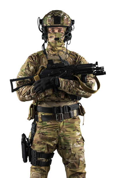 Soldier holding assault rifle. Uniform conforms to special services of the Russian Federation. Shot in studio. Isolated with clipping path on white background - Valokuva, kuva