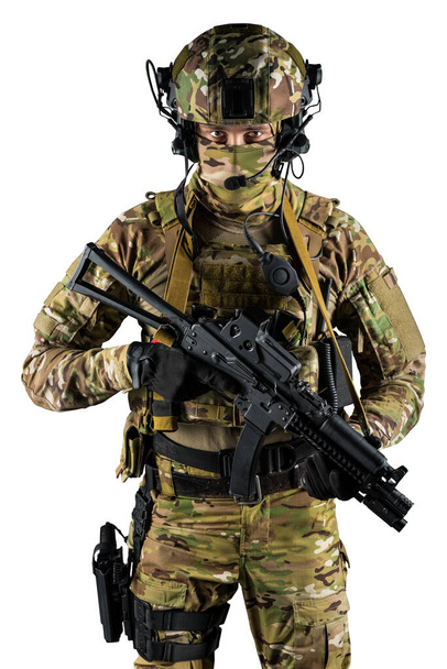Soldier holding assault rifle. Uniform conforms to special services of the Russian Federation. Shot in studio. Isolated with clipping path on white background - Fotografie, Obrázek