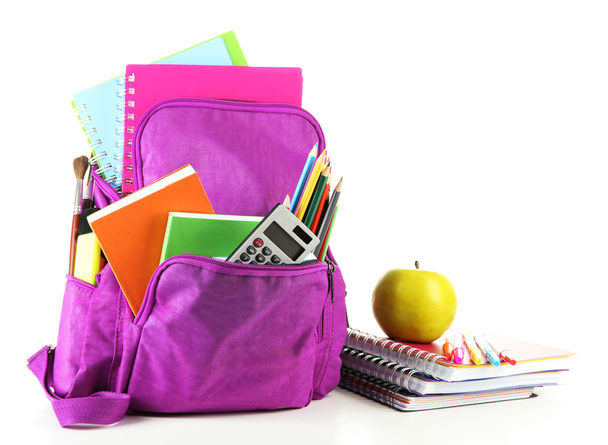 Purple backpack with school supplies isolated on white - Foto, immagini