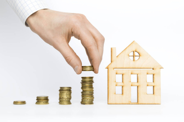 Coins and house. Real estate investment concept. Mortgage. Rental income. - Photo, Image