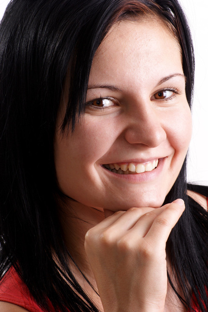 Una joven sonríe en una cámara digital
 - Foto, Imagen