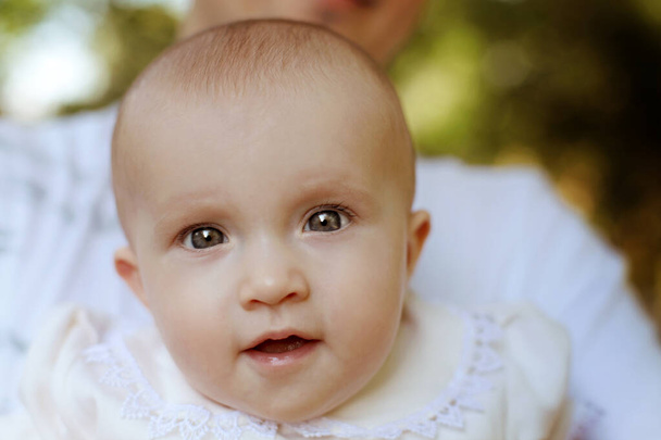 Closeup of beautiful girl eyes. Beautiful grey eyes macro shot. Concept photo of mother day, healthy childhood, perfect caucasian infant, lovely kid, innocence concept. Selective focus. Medium sharp. - Photo, Image