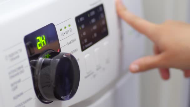 Girl Turns On the Washing Machine - Footage, Video