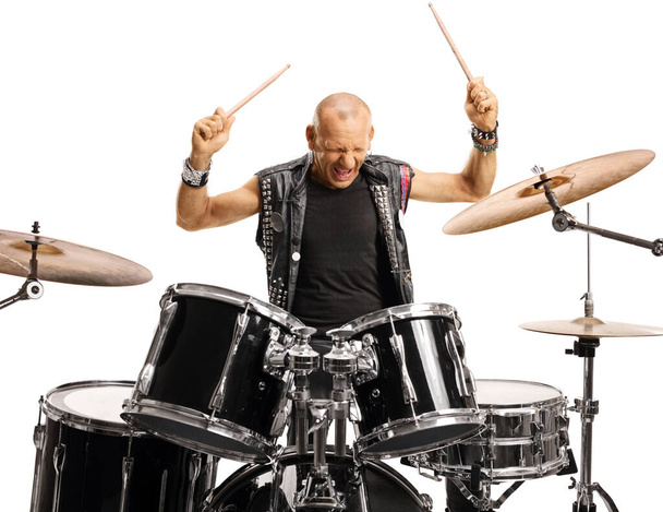 Bald man drummer starting to play drums isolated on white background - Fotó, kép