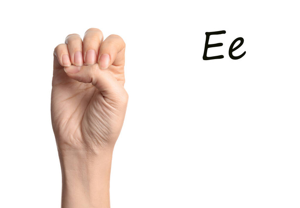 Woman showing letter E on white background, closeup. Sign language - Foto, imagen