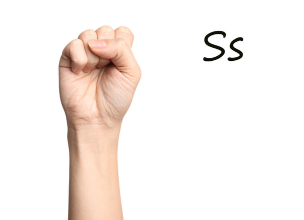 Woman showing letter S on white background, closeup. Sign language - Foto, afbeelding